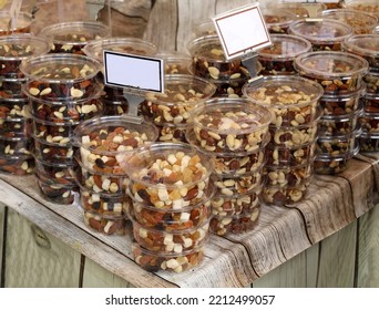 Energy Snacks With Nuts And Dried Fruit In Plastic Containers On The Store Shelf