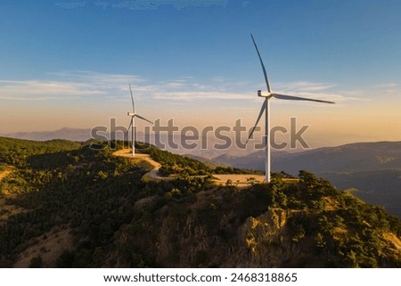 Similar – Image, Stock Photo Wind energy. Wind power. Sustainable, renewable energy. Wind turbine in clear blue sky generate electricity. Sustainable resources. Sustainable development. Green technology for energy sustainability.