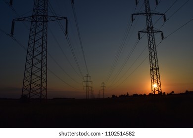 Energy transmission grid in Denmark during sunset. 