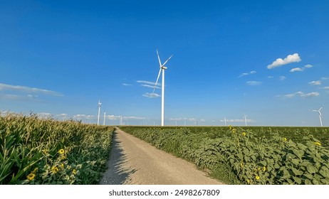 An energy windmill using wind power. An electric power generator is a wind turbine. A modern ecological power plant. A windmill in the field of Europe. Renewable energy. Electricity generation.