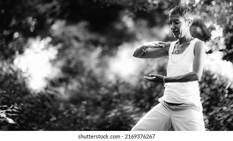 Energy Work And Mindfulness Practice. Young Woman Doing Energy Work In A Forest