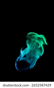 Engage with this captivating visual of vibrant green and blue flames dancing in fluid motion. An enchanting display of light and energy against a black background.