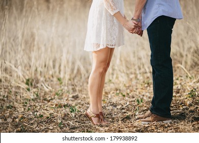 Engaged Couple Holding Hands