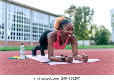 Exercise woman with fitness elastic band workout in outdoor gym