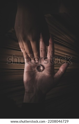 Similar – Close-up of a man’s hand holding a dried leaf of quercus