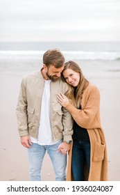 Engagement Photo Of Young Couple On Beach After Proposal