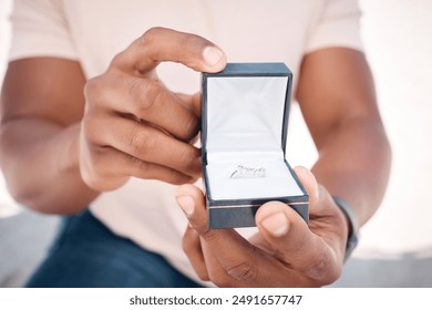 Engagement ring, ask or hands of man in proposal for romance, love or commitment offer. Box, giving jewellery or guy on knee for question or diamond wedding band on valentines day or anniversary date - Powered by Shutterstock