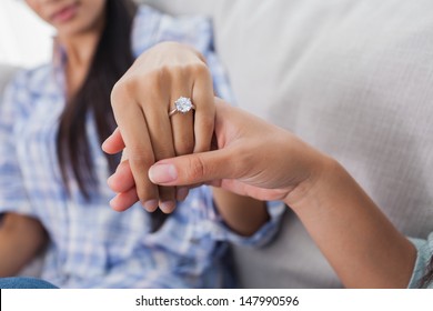 Engagement ring on womans hand held by her friend - Shutterstock ID 147990596