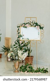 Engagement Or Wedding Floral Gold Coloured Welcome Board And Easel In Banquet Hall