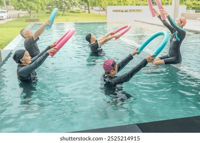 An engaging aquatic exercise class for seniors led by an instructor in a pool. The participants use colorful foam noodles, practicing water-based exercises to stay fit, healthy, and active. - Powered by Shutterstock - Get 15% off with code: PIKWIZARD15