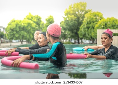 An engaging aquatic exercise class for seniors led by an instructor in a pool. The participants use colorful foam noodles, practicing water-based exercises to stay fit, healthy, and active. - Powered by Shutterstock