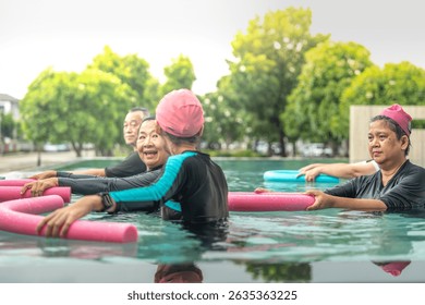 An engaging aquatic exercise class for seniors led by an instructor in a pool. The participants use colorful foam noodles, practicing water-based exercises to stay fit, healthy, and active.