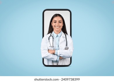 Engaging female doctor with a radiant smile is shown on a smartphone screen, symbolizing telehealth and modern medical consultations - Powered by Shutterstock