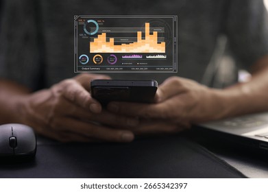 Engaging image showcasing a professional using a smartphone in a remote work setting. The digital interface displays analytical data and charts for effective decision-making.