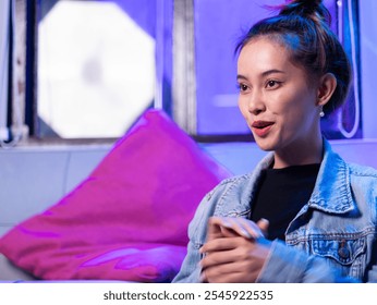 Engaging interview with young woman urban studio portrait modern setting close-up personal insights - Powered by Shutterstock