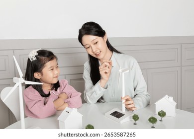 Engaging learning experience about renewable energy in a Korean classroom with a girl and her instructor