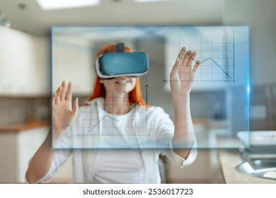 Engaging with virtual reality technology while analyzing data in a modern kitchen setting during the daytime - Powered by Shutterstock