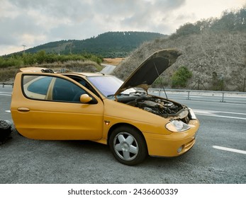 engine breakdown on the road. Broken down car on the side of the road.