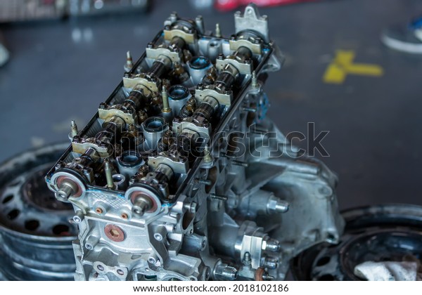 Engine for car\
repair service. \
The engine cover was opened. The engine is a\
spare part for repairing racing\
cars.