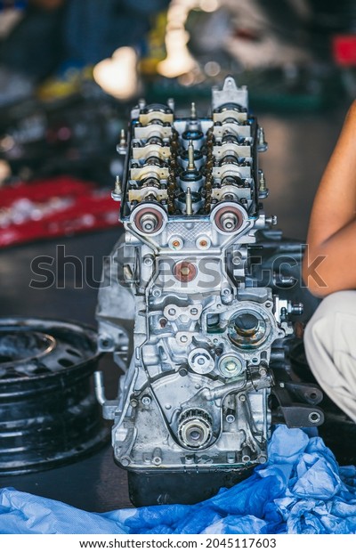 Engine for car\
repair service. \
The engine cover was opened. The engine is a\
spare part for repairing racing\
cars.