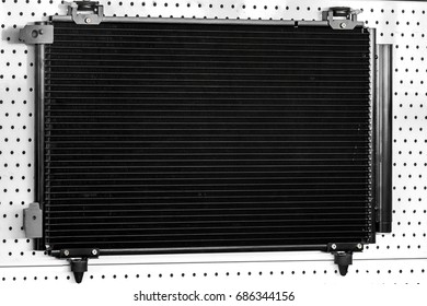 Engine Cooling Radiator Black Color, Car Spare Part On Stand.