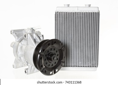 Engine cooling radiators and automotive air conditioning compressor