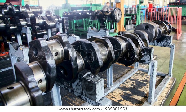 Engine crankshaft at the\
factory, Crankshaft, Warehouse, Shop, Locomotive, Train production\
and repair.
