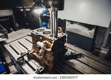 Engine cylinder boring on cnc machine. Boring under the piston after engine sleeve using machine with Computer Numerical Control.