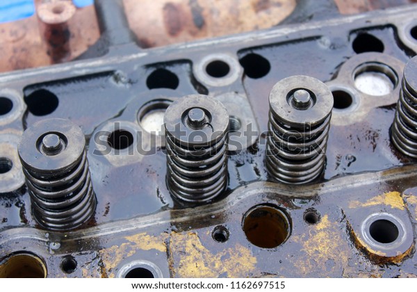 engine exhaust valve and intake valve\
\
, machine\
parts damaged from work.