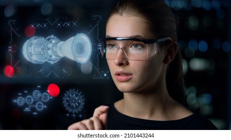 Engine hologram inspection woman analyse holographic image in digital glasses. Closeup futuristic automobile industry specialist checking turbine project designing motor. High tech engineering concept - Shutterstock ID 2101443244