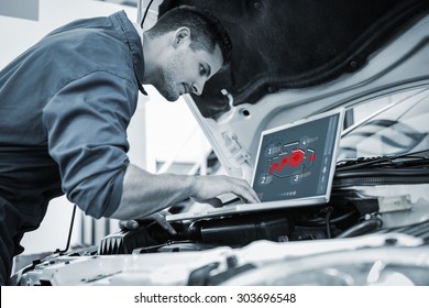 Engine interface against mechanic using laptop on car