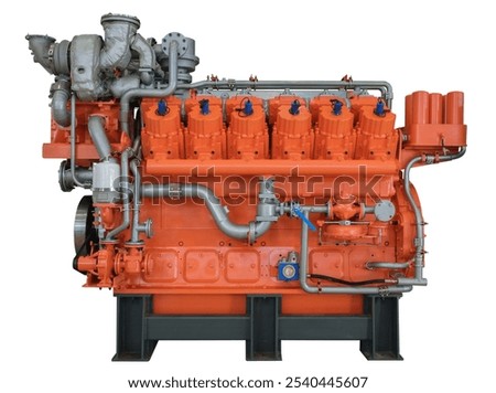 Engine is a large, orange and silver machine with many cylinders on white.  It is a powerful and efficient piece of machinery, designed to generate a significant amount of power