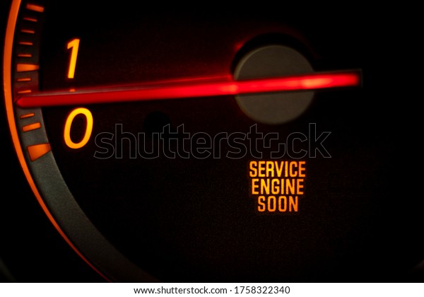 “SERVICE ENGINE SOON” light on dashboard of car in\
need of service or\
repair