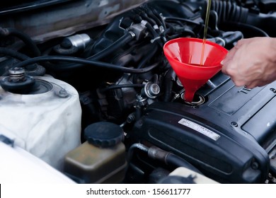 Engine Maintenance With A Cone. Automotive Oil Change Auto Maintenance.