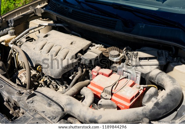 The engine\
of the modern car, the bonnet is\
open.