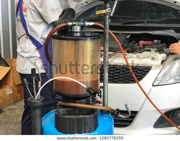 Engine oil changing\
with Oil suction machine