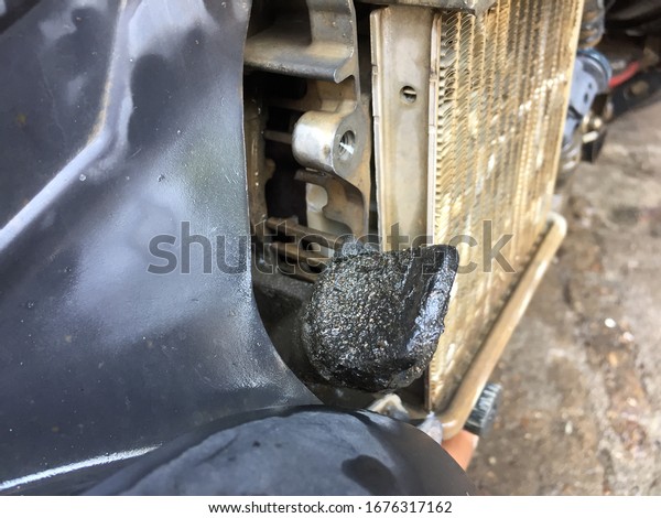 Engine oil leak\
on motorcycle engine,\
motorcycle