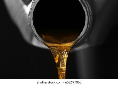 Engine Oil Pouring From Canister, Closeup