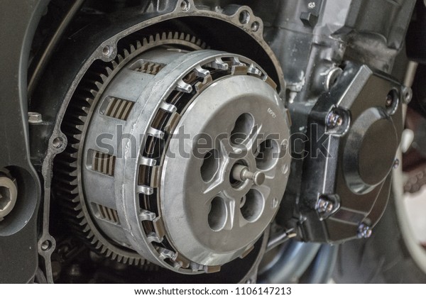 Engine parts of\
motorcycles.Close-up of an open engine block and clutch.Maintenance\
of motorcycle engine\
