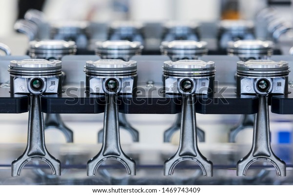 The engine parts, new pistons on the rack at\
automobile assembly line production plant. Automotive &\
technology markets\
industry.