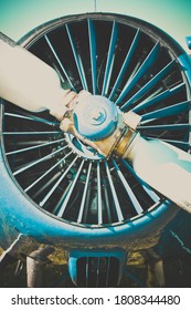 Engine and propeller of an airplane close up. Front of a propeller driven airplane. Single propeller. Retro style.