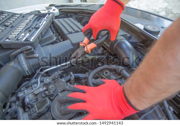 Engine repair. Checking\
of a car performance in car-care service. Maintenance of automotive\
engine
