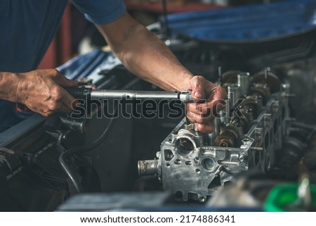 Engine repair and service in garage service shop.