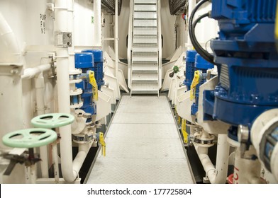Engine Room Spaces on a modern vessel - engineering interior including pipes, cables, pumps