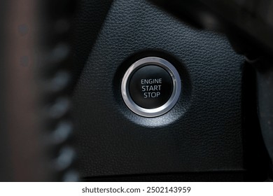 Engine start button with chrome glowing ring on a modern car - Powered by Shutterstock