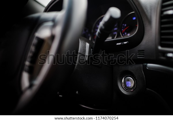 Engine Start Button on my car. Car interior, key,\
start&stop. Detail on the start button in a car. Automotive\
detail Start Stop\
button.