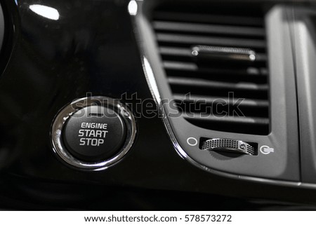Engine start stop button