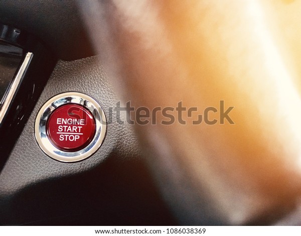 Engine start and stop button in car ,\
transportation concept