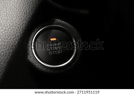 Engine start stop button in a modern car interior. concept transport travel. 	