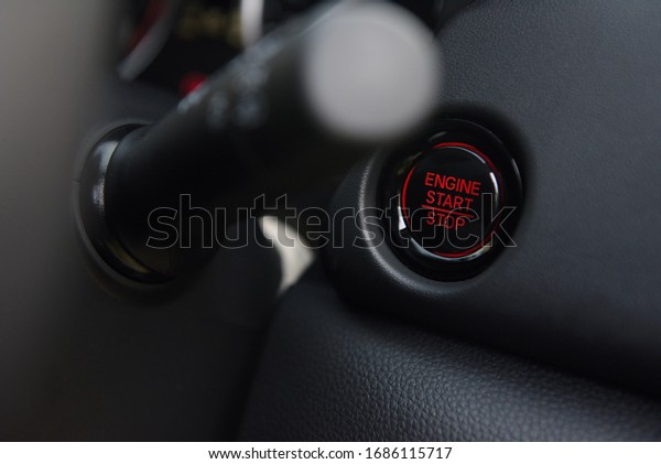 engine start stop with red light in a new\
technology car engine start stop\
button